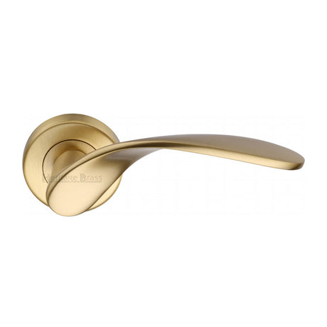 This is an image of a Heritage Brass - Door Handle Lever Latch on Round Rose Volo Design Satin Brass finish, v1950-sb that is available to order from T.H Wiggans Ironmongery in Kendal.