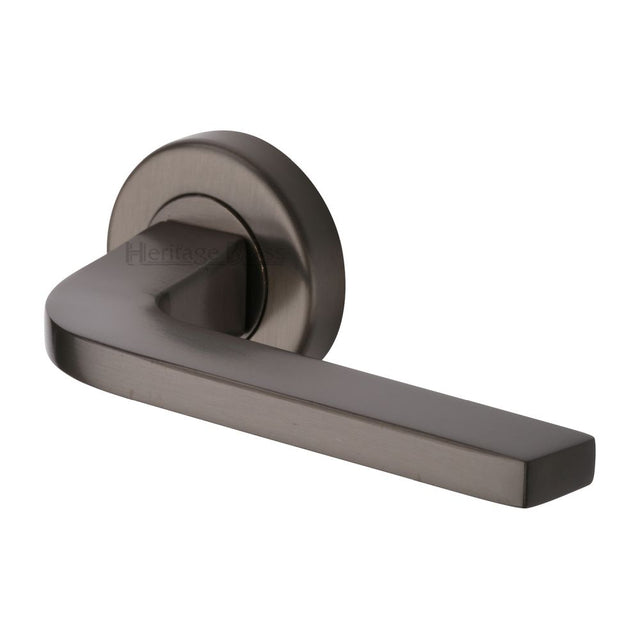This is an image of a Heritage Brass - Door Handle Lever on Rose Bellagio Design Matt Bronze Finish, v2015-mb that is available to order from T.H Wiggans Ironmongery in Kendal.