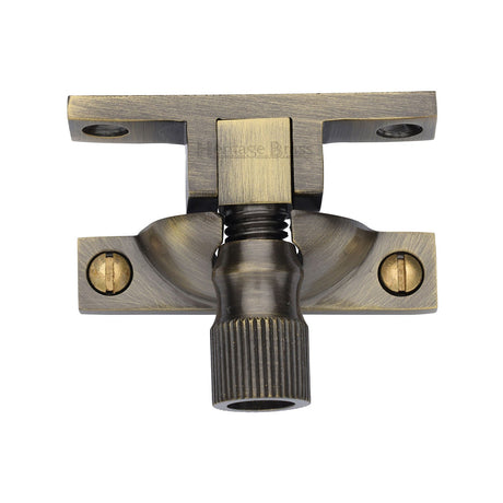 This is an image of a Heritage Brass - Narrow Brighton Sash Fastener Antique Brass finish, v2054-at that is available to order from T.H Wiggans Ironmongery in Kendal.