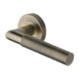 This is an image of a Heritage Brass - Door Handle Lever Latch on Round Rose Bauhaus Mitre Knurled Des, v2272-at that is available to order from T.H Wiggans Ironmongery in Kendal.