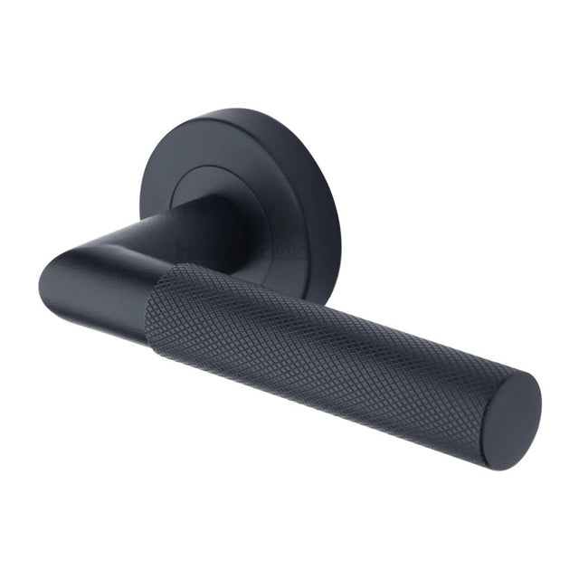 This is an image of a Heritage Brass - Door Handle Lever Latch on Round Rose Bauhaus Mitre Design Matt, v2272-bkmt that is available to order from T.H Wiggans Ironmongery in Kendal.