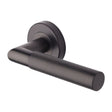 This is an image of a Heritage Brass - Door Handle Lever Latch on Round Rose Bauhaus Mitre Knurled Des, v2272-mb that is available to order from T.H Wiggans Ironmongery in Kendal.