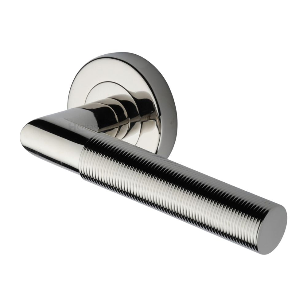 This is an image of a Heritage Brass - Door Handle Lever Latch on Round Rose Bauhaus Mitre Reeded Desi, v2274-pnf that is available to order from T.H Wiggans Ironmongery in Kendal.