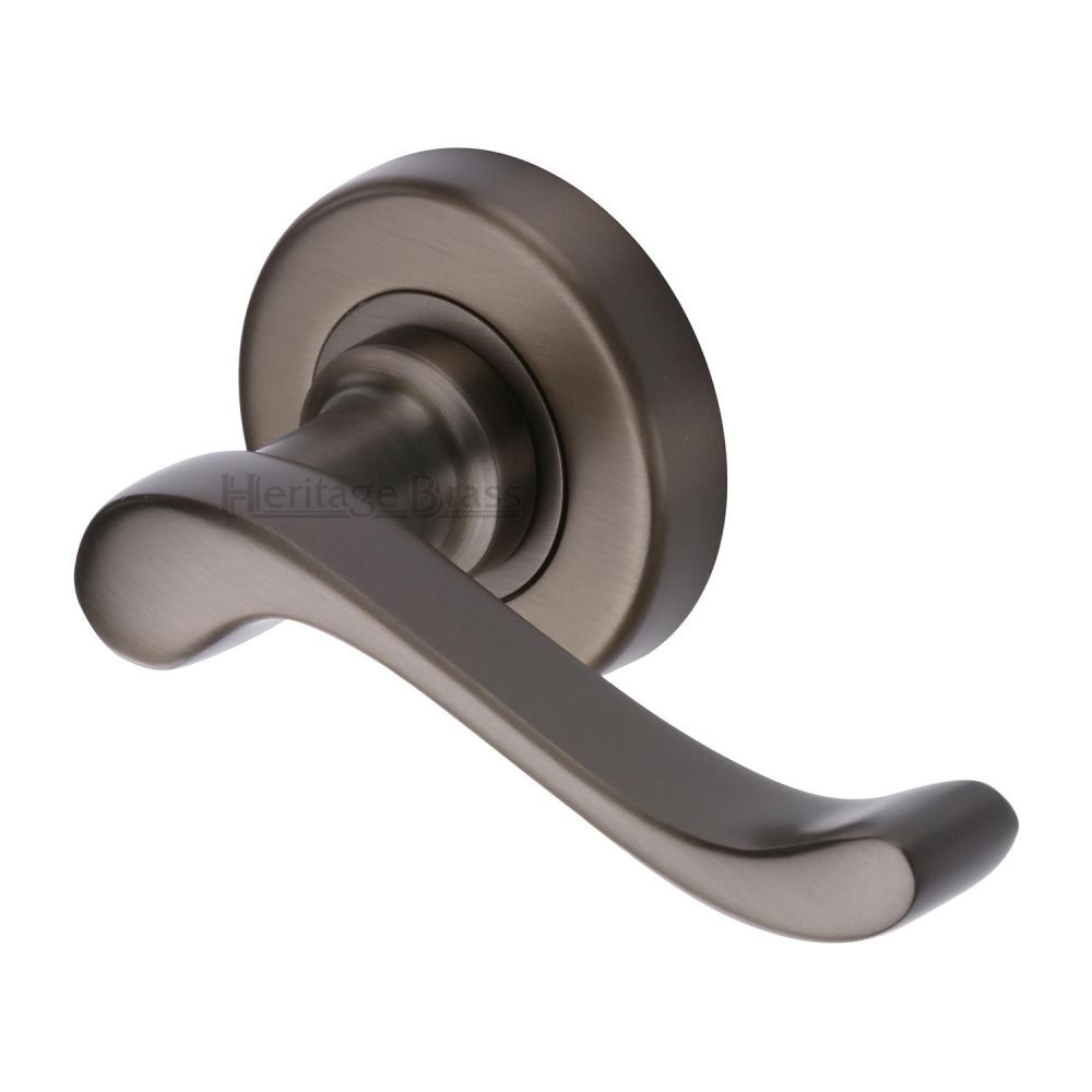 This is an image of a Heritage Brass - Door Handle Lever Latch on 53mm Round Rose Bedford Design Matt, v3010-mb that is available to order from T.H Wiggans Ironmongery in Kendal.