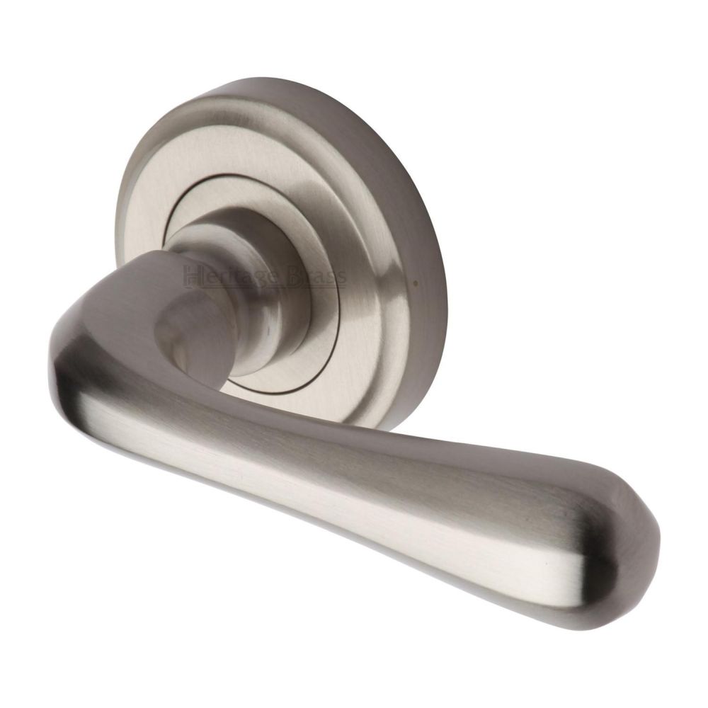 This is an image of a Heritage Brass - Door Handle Lever Latch on Round Rose Charlbury Design Satin Nic, v3020-sn that is available to order from T.H Wiggans Ironmongery in Kendal.