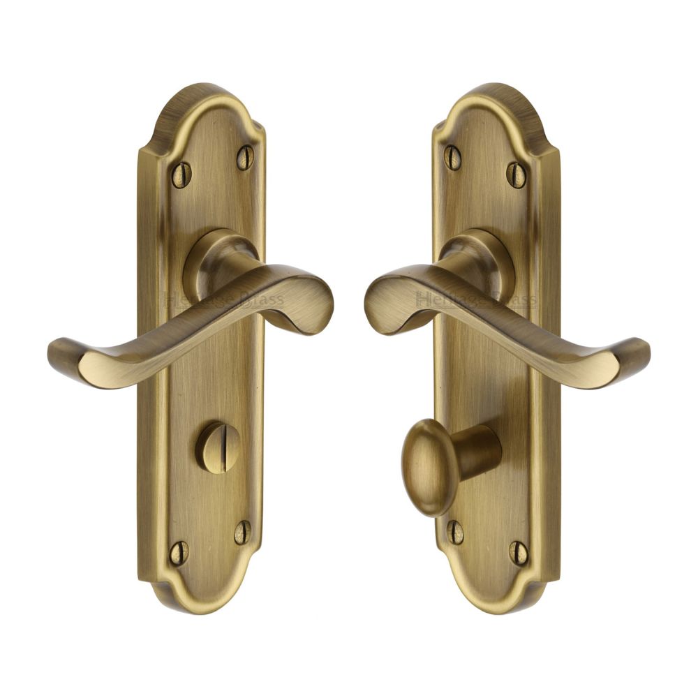 This is an image of a Heritage Brass - Door Handle for Bathroom Meridian Design Antique Brass Finish, v330-at that is available to order from T.H Wiggans Ironmongery in Kendal.