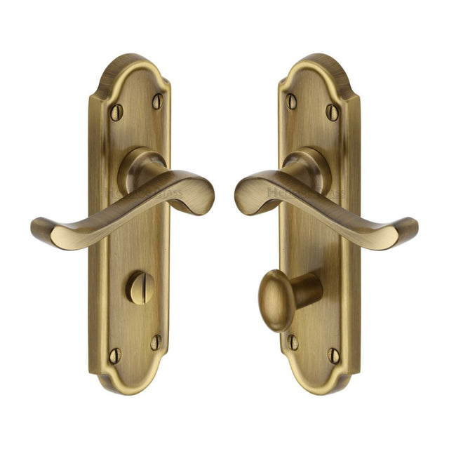 This is an image of a Heritage Brass - Door Handle for Bathroom Meridian Design Antique Brass Finish, v330-at that is available to order from T.H Wiggans Ironmongery in Kendal.