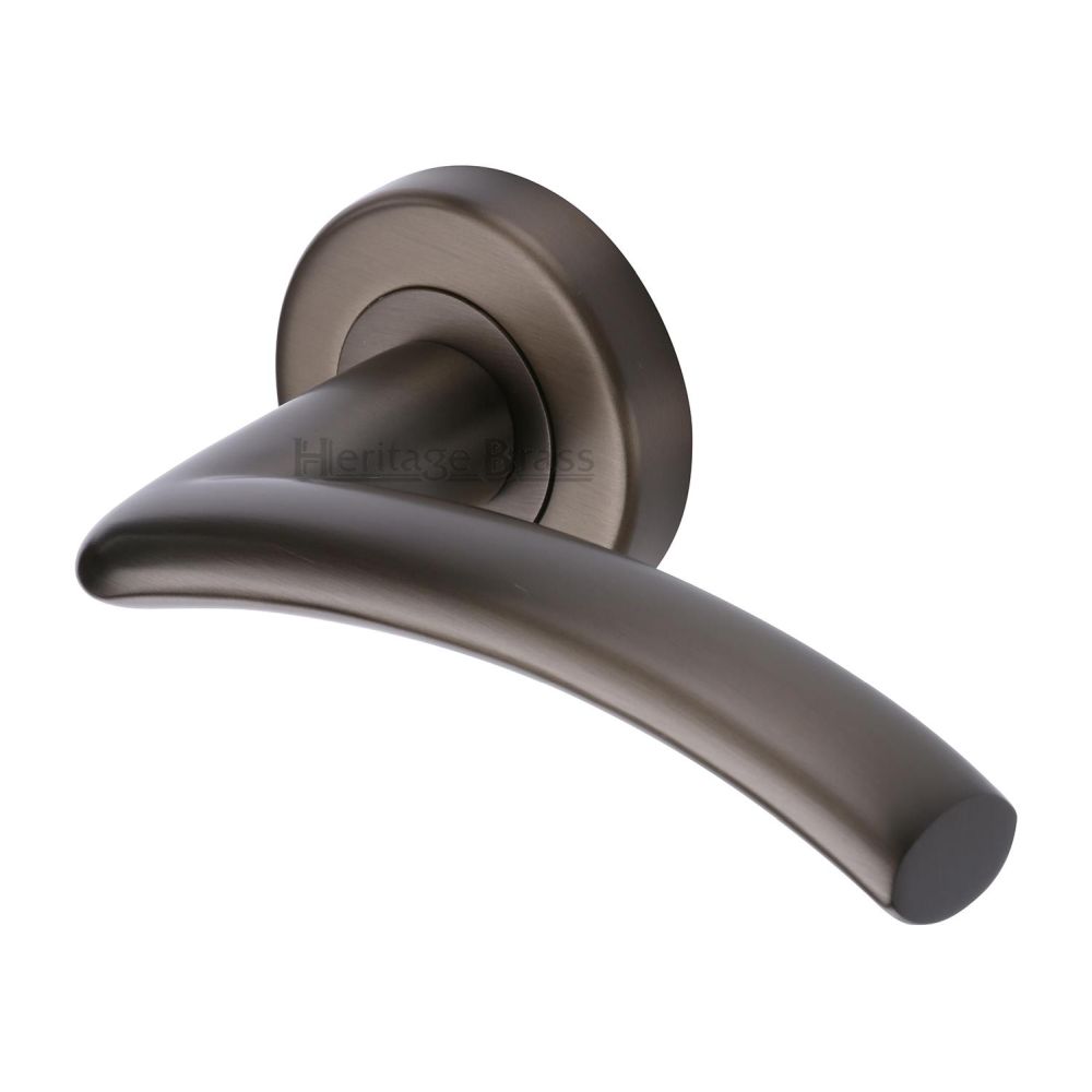 This is an image of a Heritage Brass - Door Handle Lever Latch on Round Rose Centaur Design Matt Bronz, v3490-mb that is available to order from T.H Wiggans Ironmongery in Kendal.