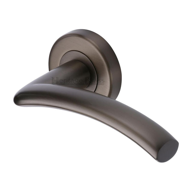 This is an image of a Heritage Brass - Door Handle Lever Latch on Round Rose Centaur Design Matt Bronz, v3490-mb that is available to order from T.H Wiggans Ironmongery in Kendal.
