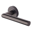 This is an image of a Heritage Brass - Door Handle Lever Latch on Round Rose Athena Design Matt Bronze, v3840-mb that is available to order from T.H Wiggans Ironmongery in Kendal.