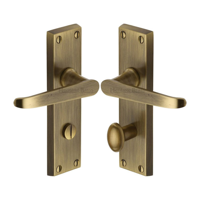 This is an image of a Heritage Brass - Door Handle for Bathroom Victoria Design Antique Brass Finish, v3930-at that is available to order from T.H Wiggans Ironmongery in Kendal.