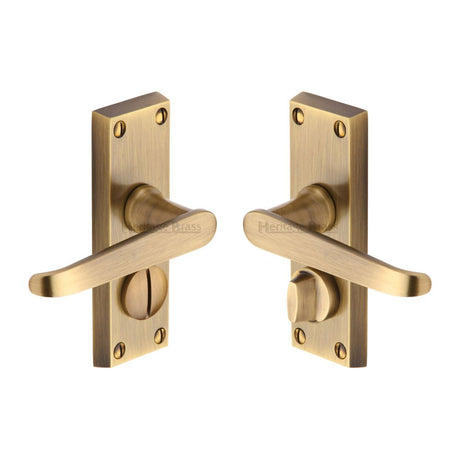 This is an image of a Heritage Brass - Door Handle for Privacy Set Victoria Short Design Antique Brass Fi, v3935-at that is available to order from T.H Wiggans Ironmongery in Kendal.