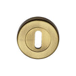 This is an image of a Heritage Brass - Key Escutcheon Antique Brass Finish, v4000-at that is available to order from T.H Wiggans Ironmongery in Kendal.