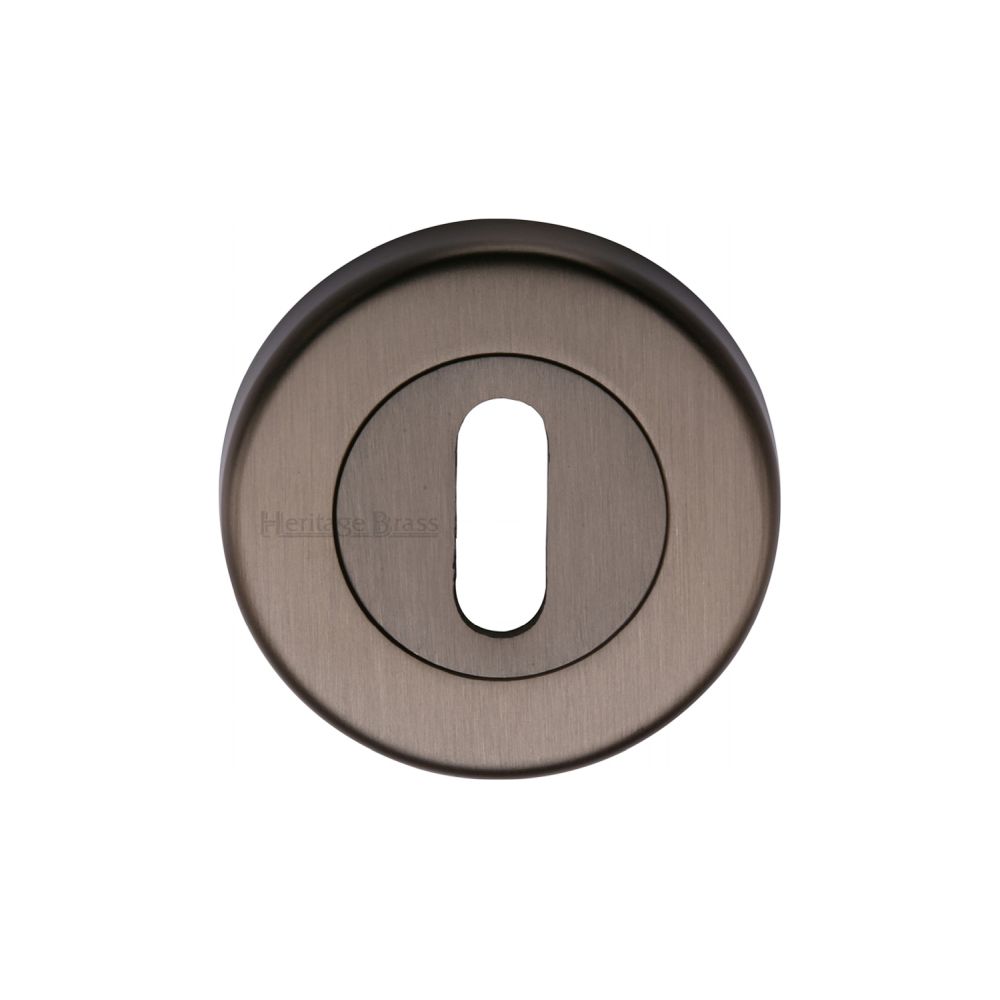 This is an image of a Heritage Brass - Key Escutcheon Matt Bronze Finish, v4000-mb that is available to order from T.H Wiggans Ironmongery in Kendal.