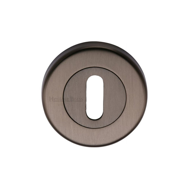 This is an image of a Heritage Brass - Key Escutcheon Matt Bronze Finish, v4000-mb that is available to order from T.H Wiggans Ironmongery in Kendal.