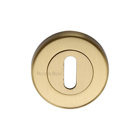 This is an image of a Heritage Brass - Key Escutcheon Satin Brass Finish, v4000-sb that is available to order from T.H Wiggans Ironmongery in Kendal.