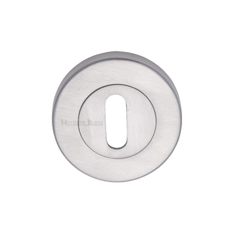 This is an image of a Heritage Brass - Key Escutcheon Satin Chrome Finish, v4000-sc that is available to order from T.H Wiggans Ironmongery in Kendal.