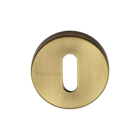 This is an image of a Heritage Brass - Key Escutcheon Antique Brass Finish, v4007-at that is available to order from T.H Wiggans Ironmongery in Kendal.