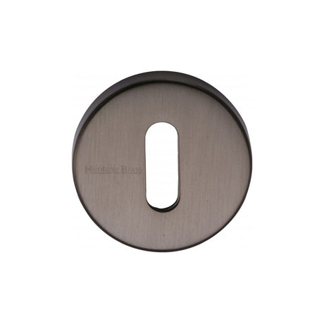 This is an image of a Heritage Brass - Key Escutcheon Matt Bronze Finish, v4007-mb that is available to order from T.H Wiggans Ironmongery in Kendal.