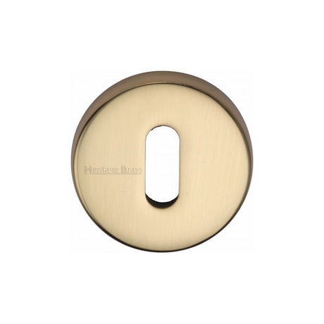 This is an image of a Heritage Brass - Key Escutcheon Polished Brass Finish, v4007-pb that is available to order from T.H Wiggans Ironmongery in Kendal.