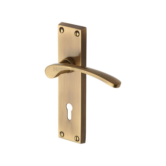 This is an image of a Heritage Brass - Door Handle Lever Lock Sophia Design Antique Brass Finish, v4130-at that is available to order from T.H Wiggans Ironmongery in Kendal.