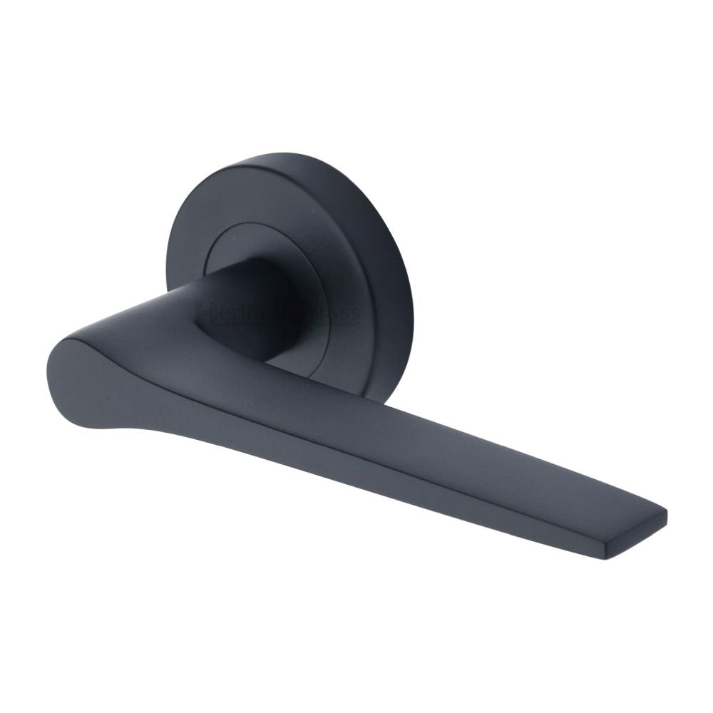 This is an image of a Heritage Brass - Door Handle Lever on Rose Gio Design Matt Black Finish, v4189-bkmt that is available to order from T.H Wiggans Ironmongery in Kendal.