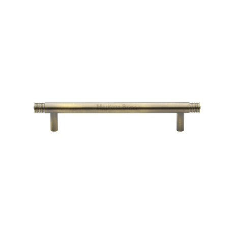 This is an image of a Heritage Brass - Cabinet Pull Contour Design 128mm CTC Antique Brass Finish, v4446-128-at that is available to order from T.H Wiggans Ironmongery in Kendal.