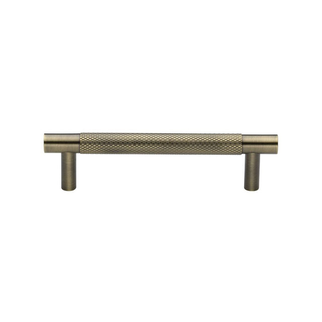 This is an image of a Heritage Brass - Cabinet Pull Partial Knurled Design 96mm CTC Antique Brass Finish, v4461-96-at that is available to order from T.H Wiggans Ironmongery in Kendal.