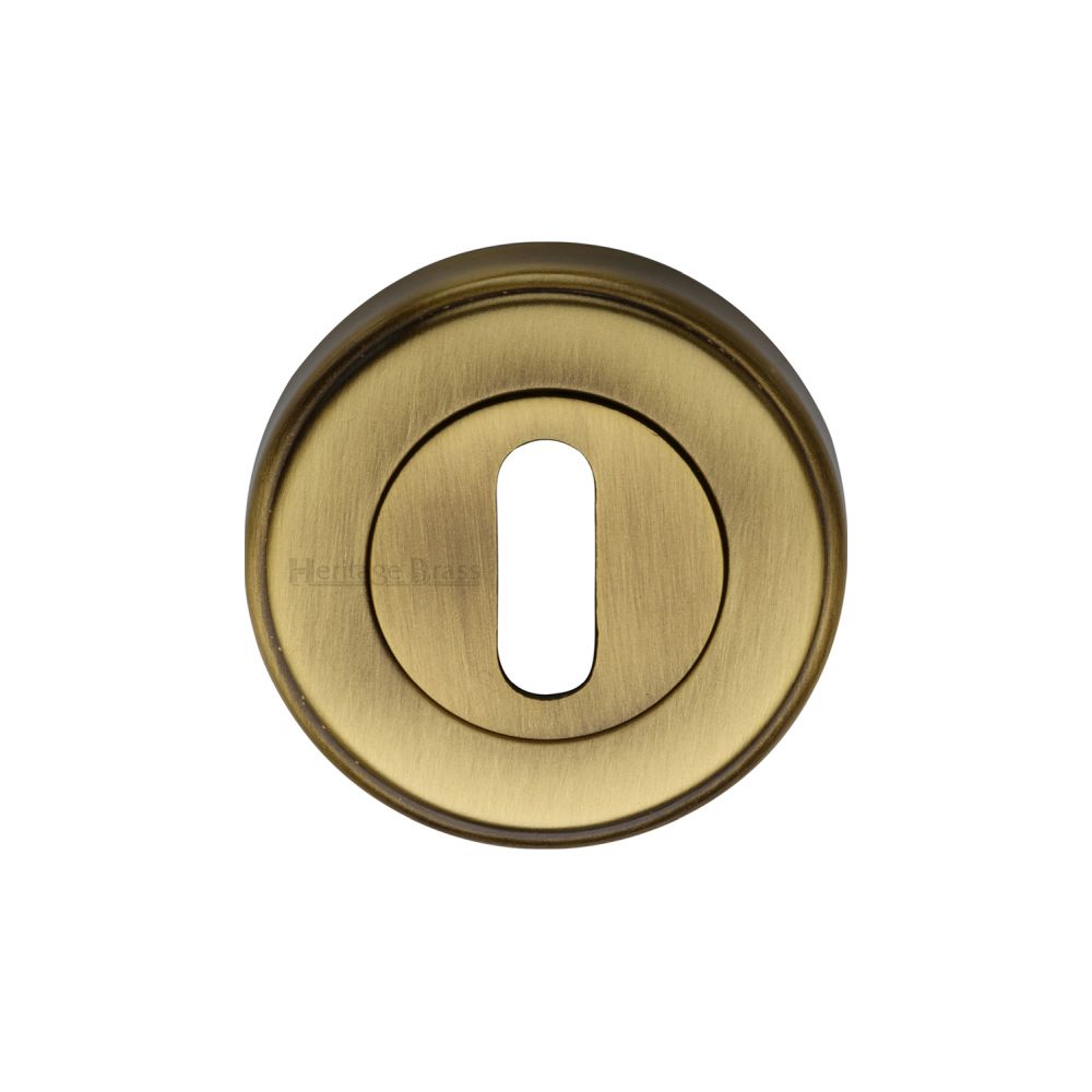 This is an image of a Heritage Brass - Key Escutcheon Antique Brass Finish, v5000-at that is available to order from T.H Wiggans Ironmongery in Kendal.