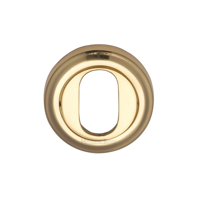 This is an image of a Heritage Brass - Oval Profile Cylinder Escutcheon Polished Brass Finish, v5010-pb that is available to order from T.H Wiggans Ironmongery in Kendal.