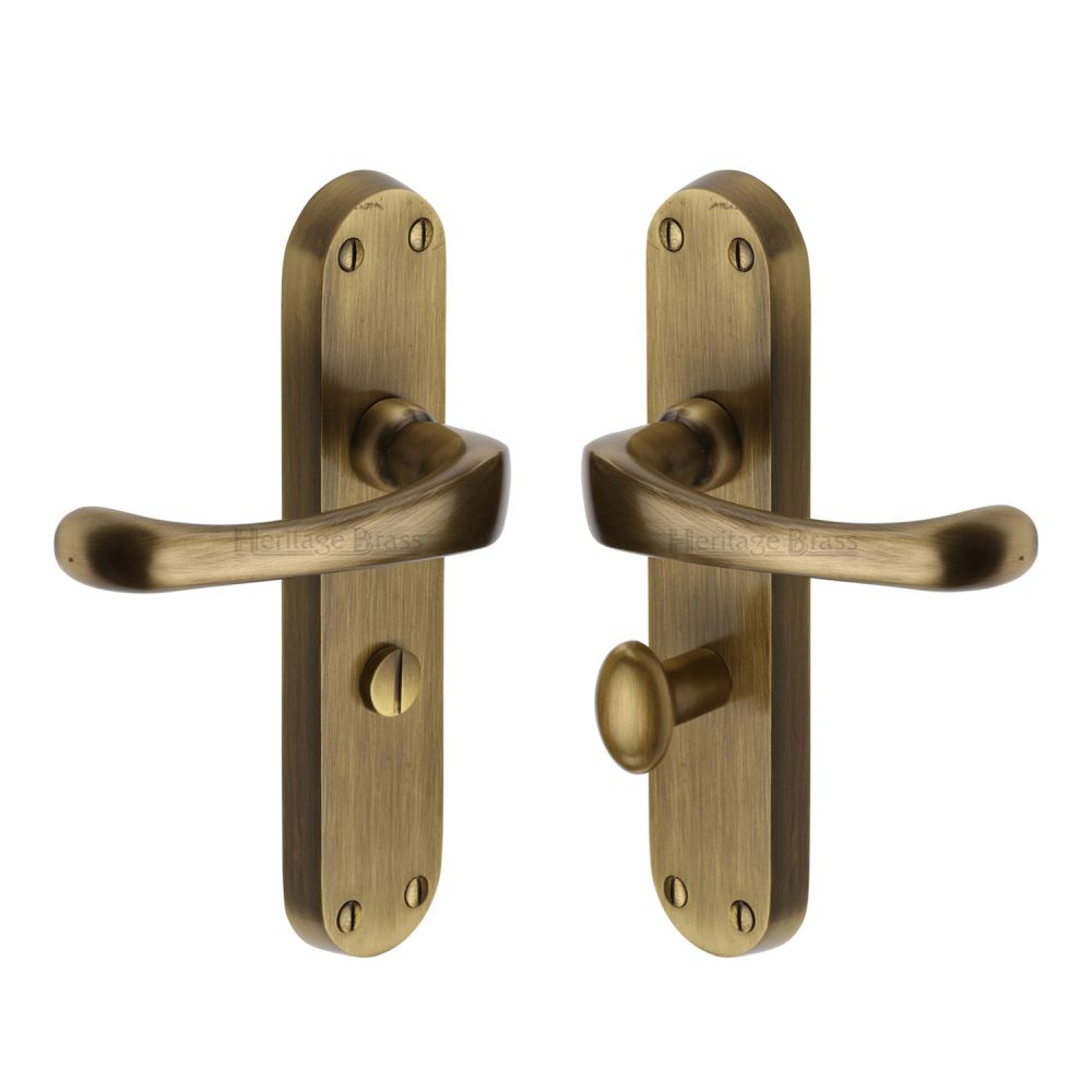 This is an image of a Heritage Brass - Door Handle for Bathroom Gloucester Design Antique Brass Finish, v6070-at that is available to order from T.H Wiggans Ironmongery in Kendal.