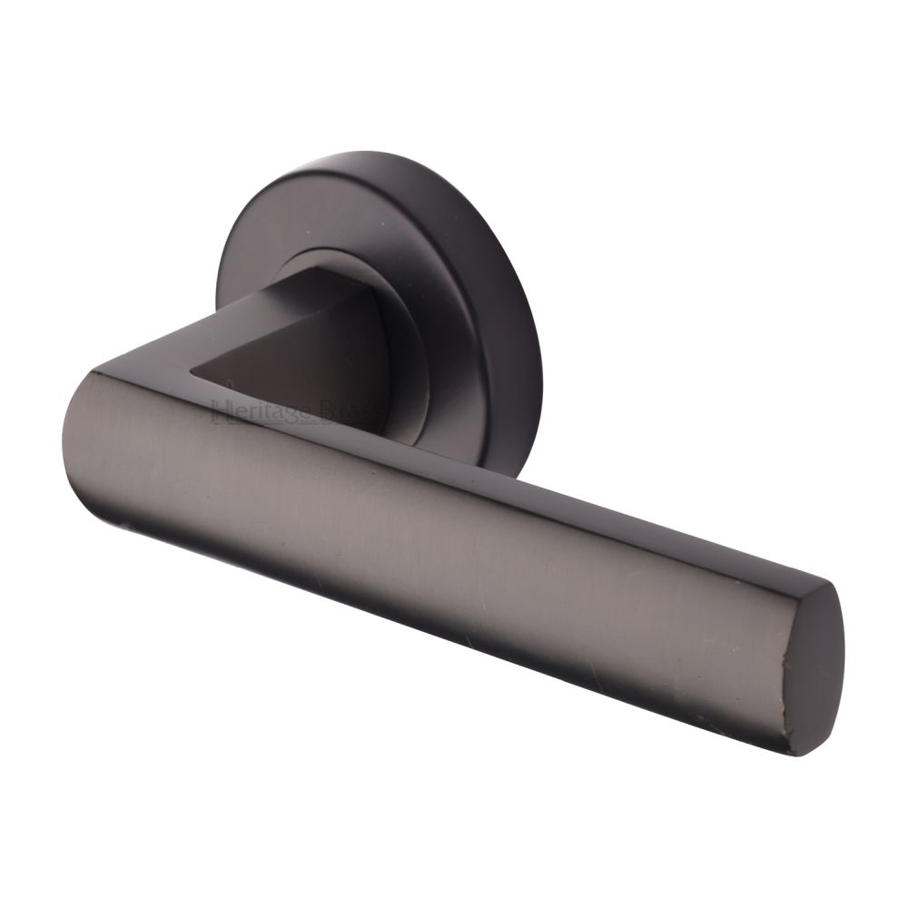 This is an image of a Heritage Brass - Door Handle Lever Latch on Round Rose Poseidon Design Matt Bron, v6230-mb that is available to order from T.H Wiggans Ironmongery in Kendal.