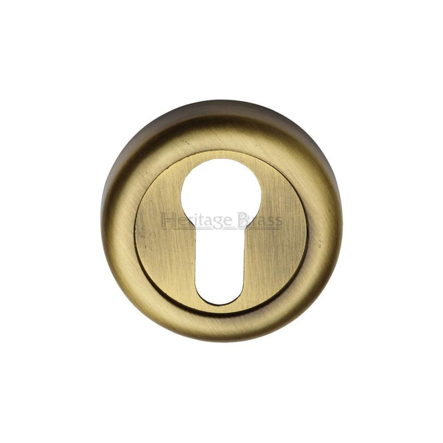 This is an image of a Heritage Brass - Euro Profile Cylinder Escutcheon Antique Brass Finish, v6724-at that is available to order from T.H Wiggans Ironmongery in Kendal.
