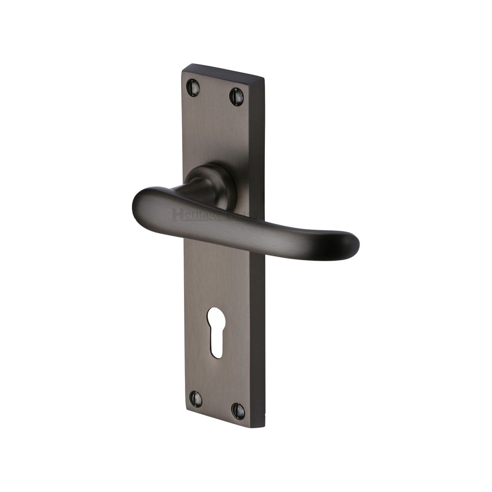 This is an image of a Heritage Brass - Door Handle Lever Lock Windsor Design Matt Bronze Finish, v700-mb that is available to order from T.H Wiggans Ironmongery in Kendal.