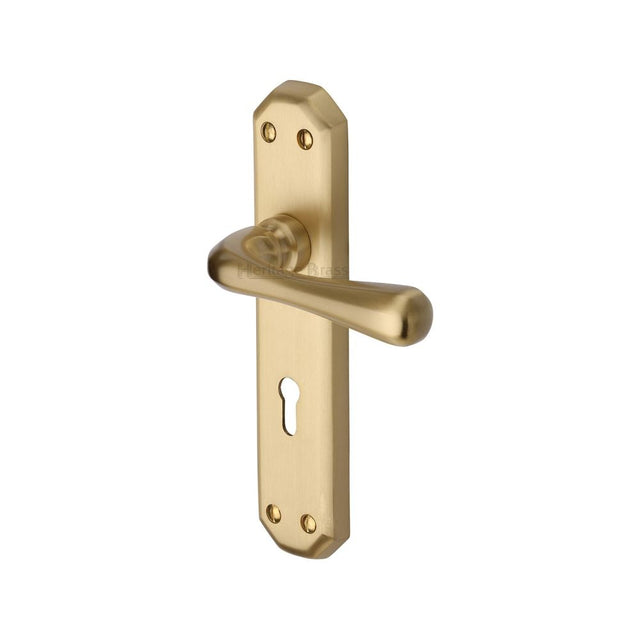 This is an image of a Heritage Brass - Door Handle Lever Lock Charlbury Design Satin Brass Finish, v7050-sb that is available to order from T.H Wiggans Ironmongery in Kendal.