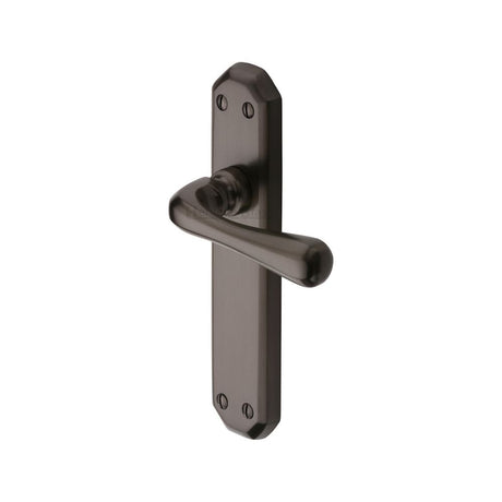 This is an image of a Heritage Brass - Door Handle Lever Latch Charlbury Design Matt Bronze Finish, v7060-mb that is available to order from T.H Wiggans Ironmongery in Kendal.