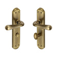 This is an image of a Heritage Brass - Door Handle for Bathroom Charlbury Design Antique Brass Finish, v7070-at that is available to order from T.H Wiggans Ironmongery in Kendal.