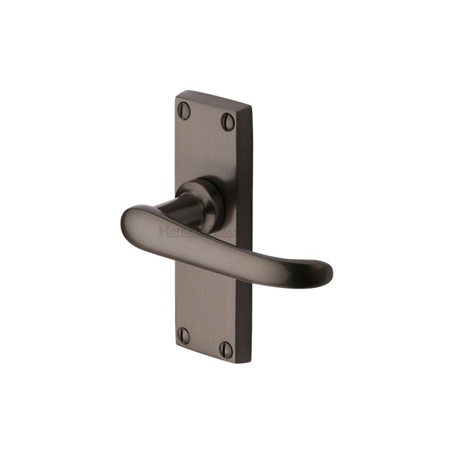 This is an image of a Heritage Brass - Door Handle Lever Latch Windsor Short Design Matt Bronze Finish, v710-mb that is available to order from T.H Wiggans Ironmongery in Kendal.