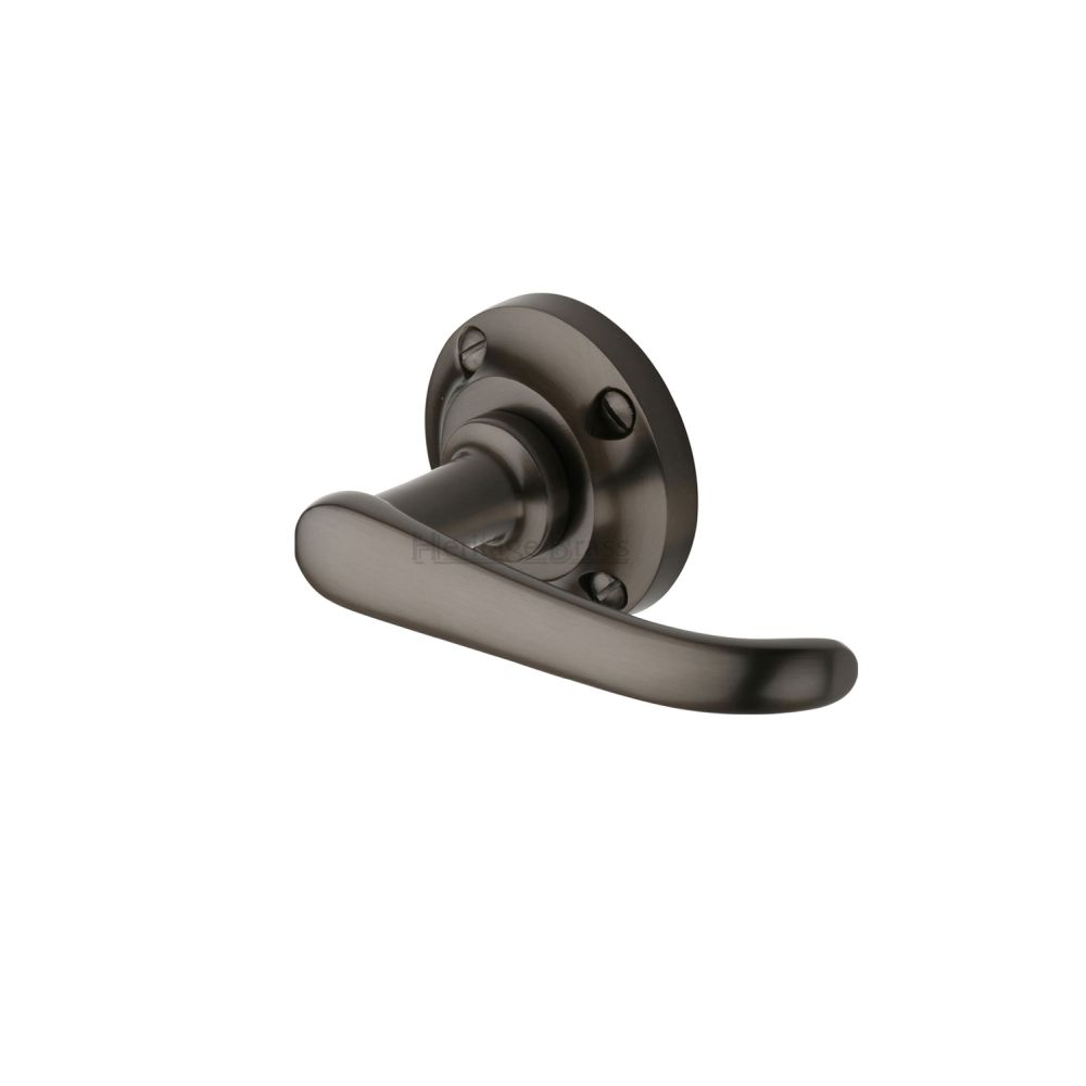 This is an image of a Heritage Brass - Door Handle Lever on Rose Windsor Design Matt Bronze Finish, v720-mb that is available to order from T.H Wiggans Ironmongery in Kendal.