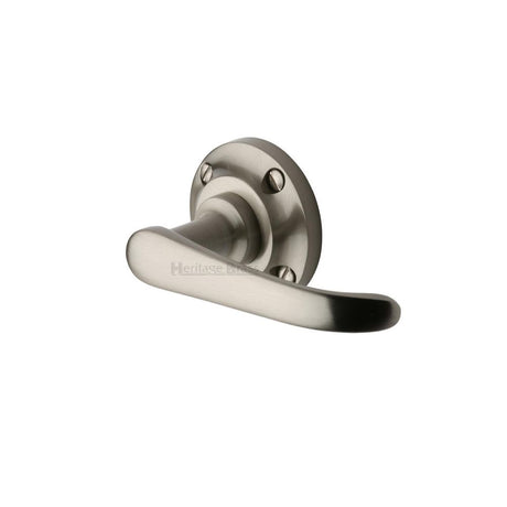 This is an image of a Heritage Brass - Door Handle Lever Latch on Round Rose Windsor Design Satin Nicke, v720-sn that is available to order from T.H Wiggans Ironmongery in Kendal.