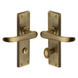 This is an image of a Heritage Brass - Door Handle for Bathroom Windsor Design Antique Brass Finish, v730-at that is available to order from T.H Wiggans Ironmongery in Kendal.