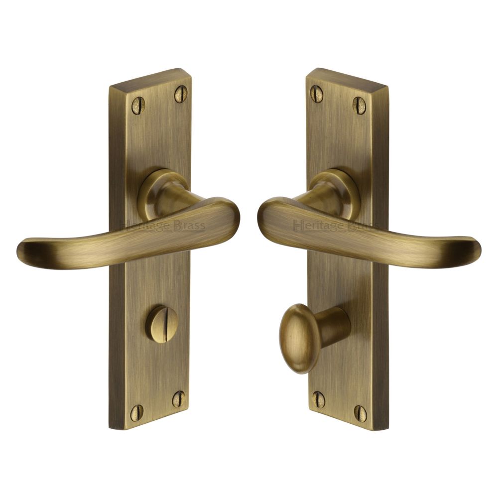 This is an image of a Heritage Brass - Door Handle for Bathroom Windsor Design Antique Brass Finish, v730-at that is available to order from T.H Wiggans Ironmongery in Kendal.