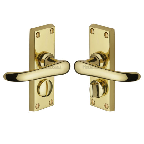 This is an image of a Heritage Brass - Door Handle for Privacy Set Windsor Short Design Polished Brass Fin, v735-pb that is available to order from T.H Wiggans Ironmongery in Kendal.