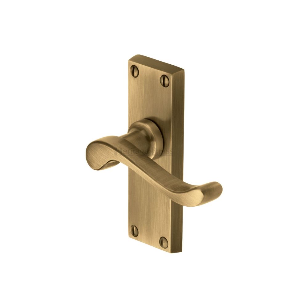 This is an image of a Heritage Brass - Door Handle Lever Latch Bedford Short Design Antique Brass Finish, v800-at that is available to order from T.H Wiggans Ironmongery in Kendal.