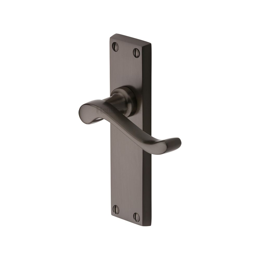 This is an image of a Heritage Brass - Door Handle Lever Latch Bedford Design Matt Bronze Finish, v803-mb that is available to order from T.H Wiggans Ironmongery in Kendal.