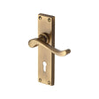 This is an image of a Heritage Brass - Door Handle Lever Lock Bedford Design Antique Brass Finish, v810-at that is available to order from T.H Wiggans Ironmongery in Kendal.