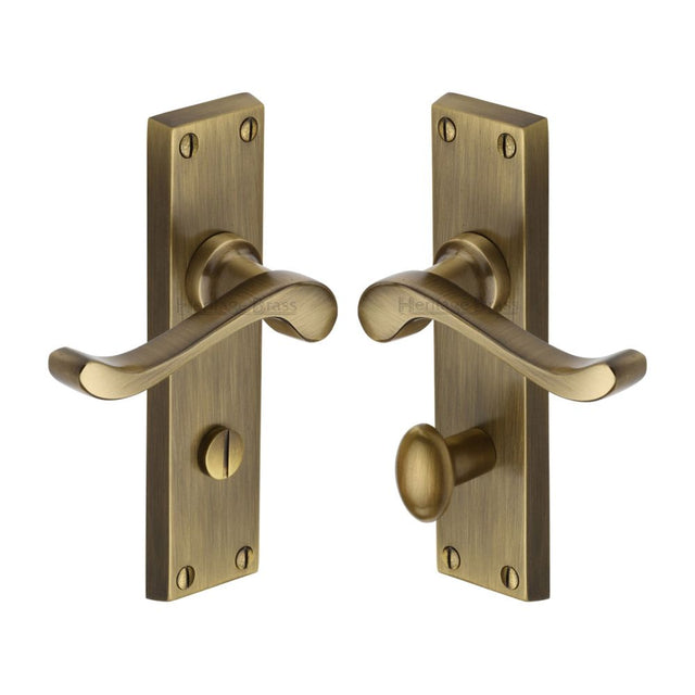 This is an image of a Heritage Brass - Door Handle for Bathroom Bedford Design Antique Brass Finish, v815-at that is available to order from T.H Wiggans Ironmongery in Kendal.