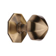 This is an image of a Heritage Brass - Octagon Centre Door Knob 2 1/2" Antique Brass Finish, v880-at that is available to order from T.H Wiggans Ironmongery in Kendal.