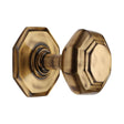 This is an image of a Heritage Brass - Octagon Centre Door Knob 3" Antique Brass Finish, v890-at that is available to order from T.H Wiggans Ironmongery in Kendal.