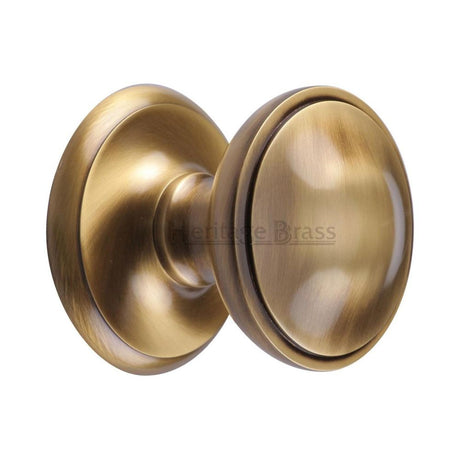 This is an image of a Heritage Brass - Round Centre Door Knob 3" Antique Brass Finish, v900-at that is available to order from T.H Wiggans Ironmongery in Kendal.